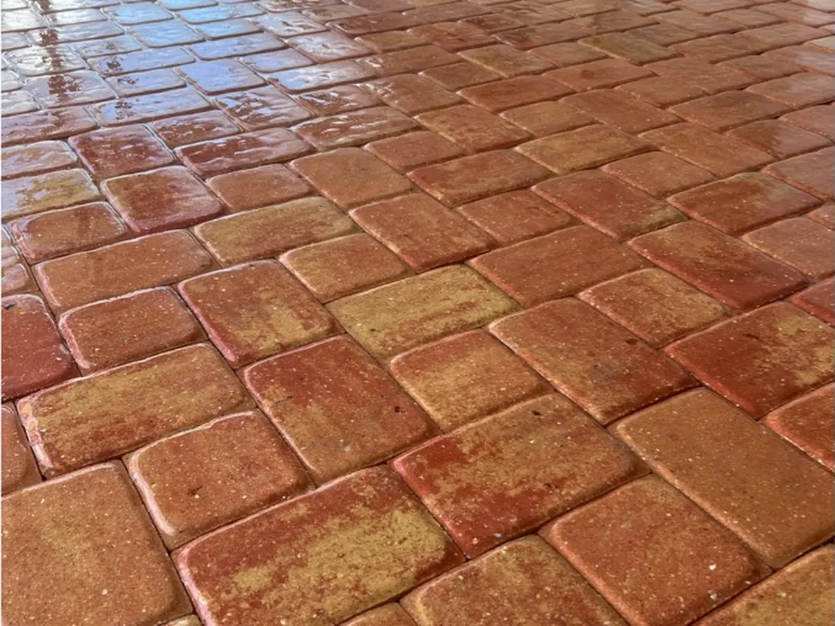 The red pavers restored to an even color