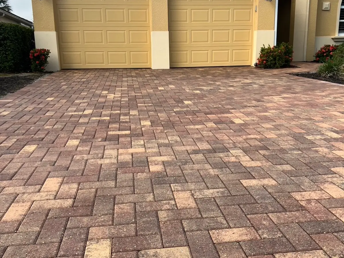 A brick paver driveway clean with warm color